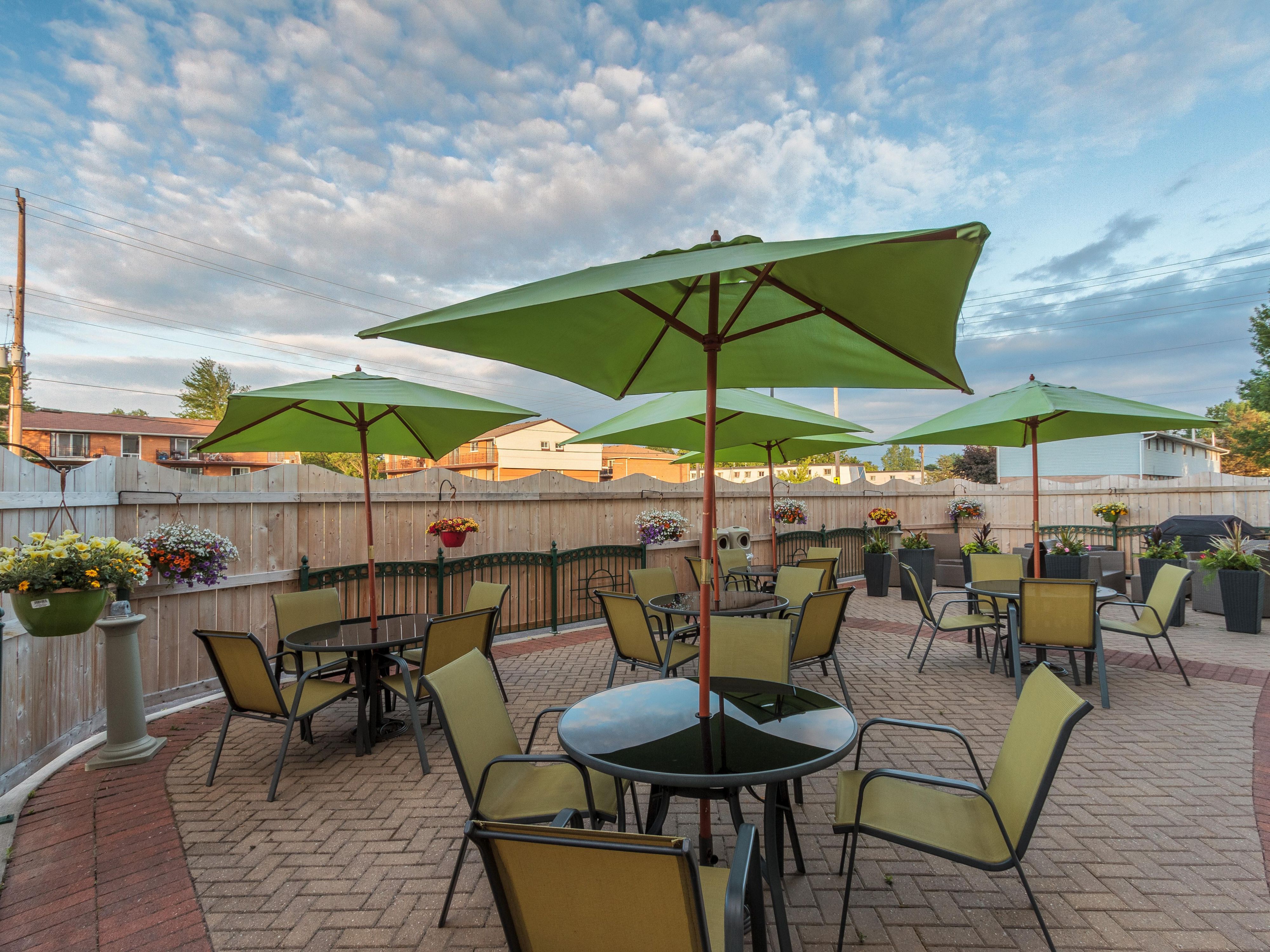 Enjoy a change of scenery on our outdoor patio complete with comfortable seating, fireplace and grills.