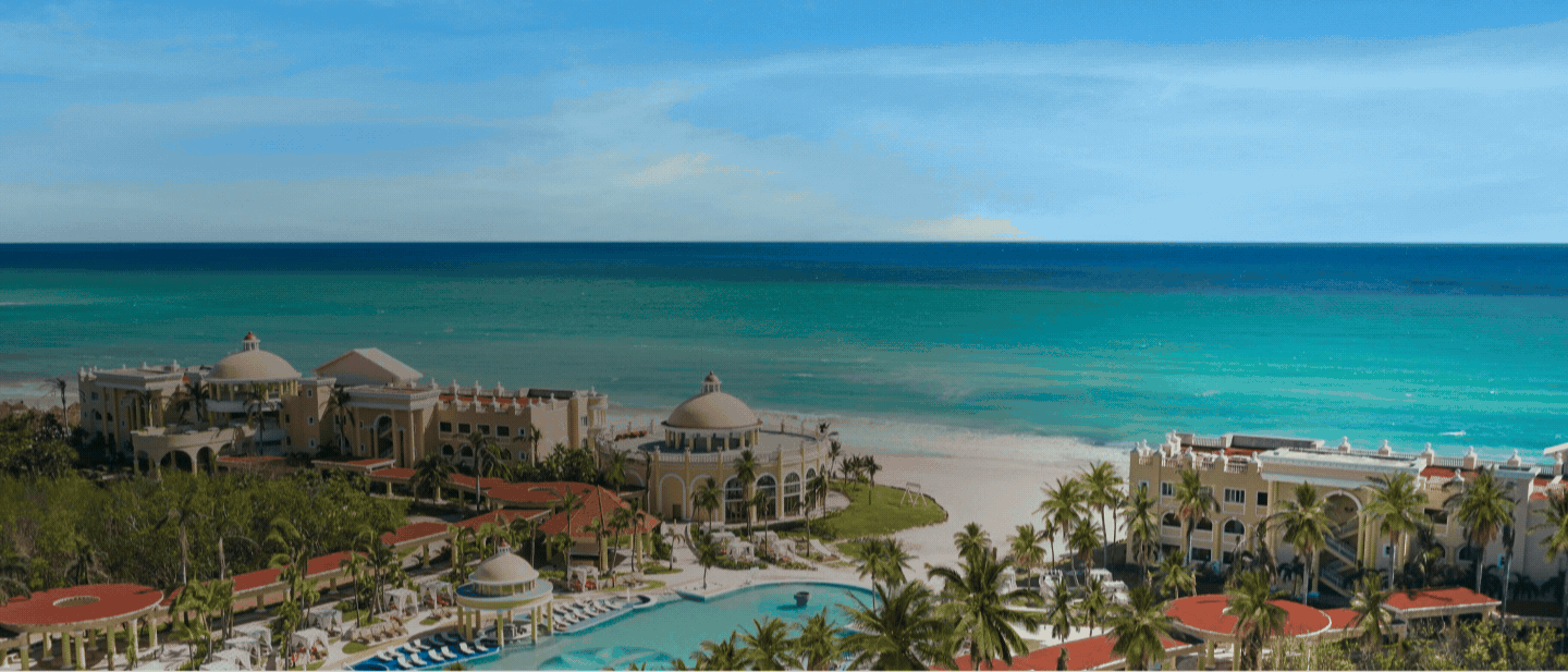 Rotating GIF of two beachfront hotels overlooking the ocean.