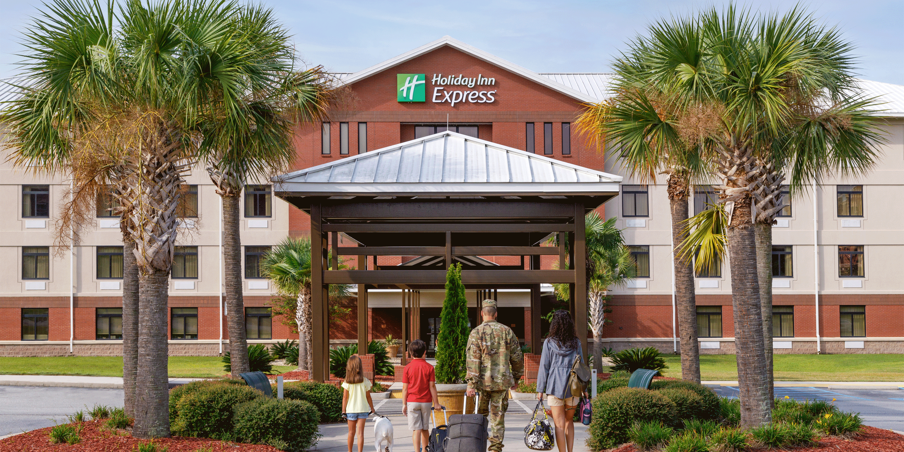 Service members and families in a hotel setting.