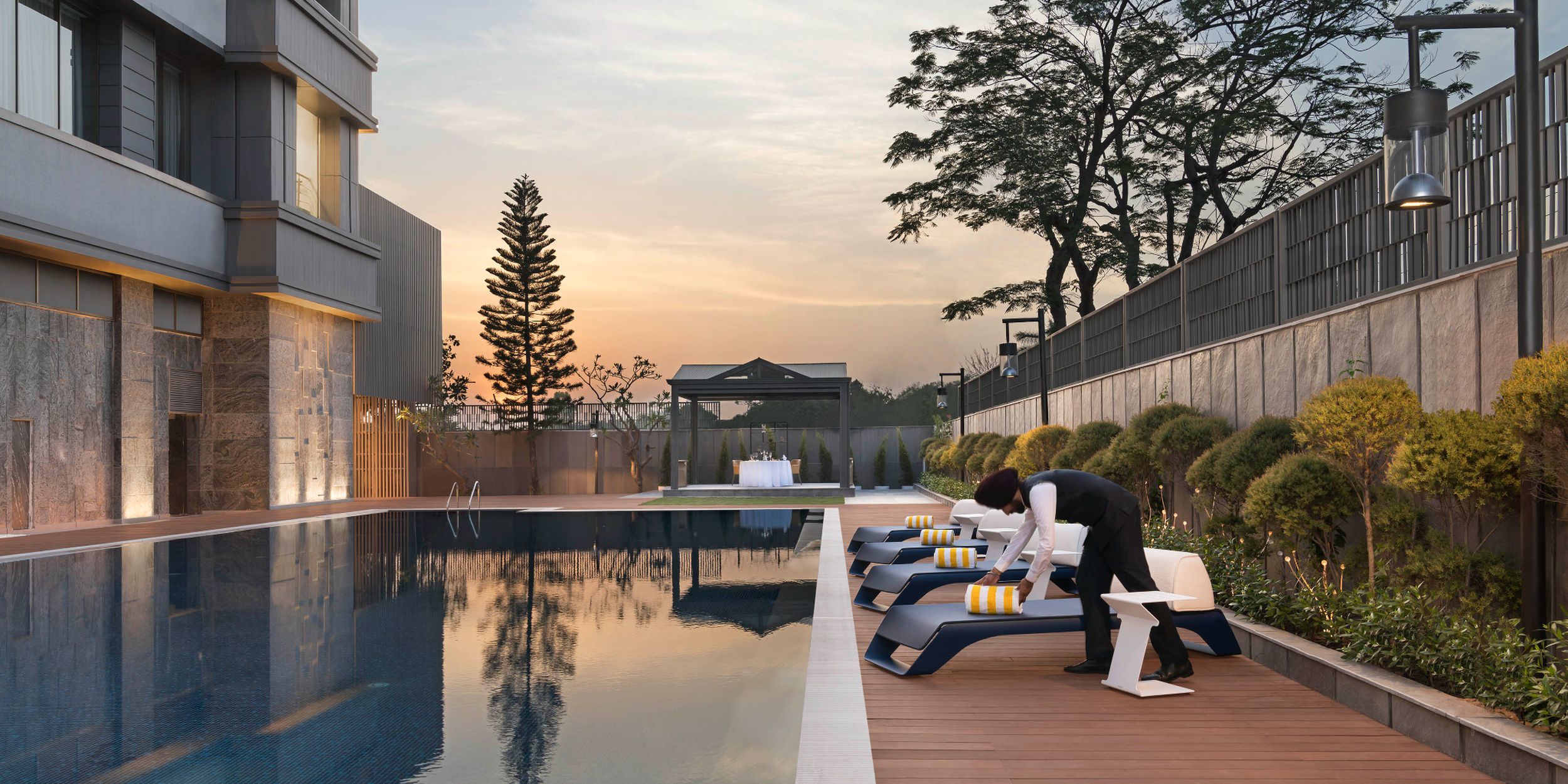 Evening shot of the swimming pool at The Aarlis Hotel Panchkula, Vignette Collection