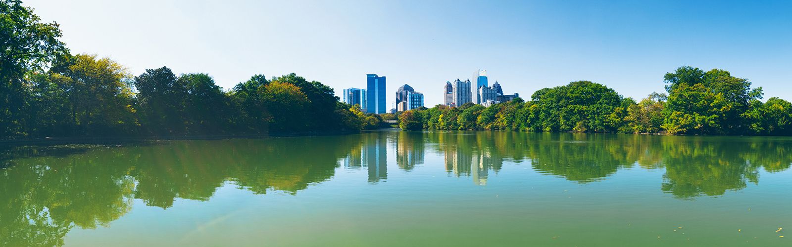 Atlanta skyline reflected in Piedmont Park's Lake Clara Meer
