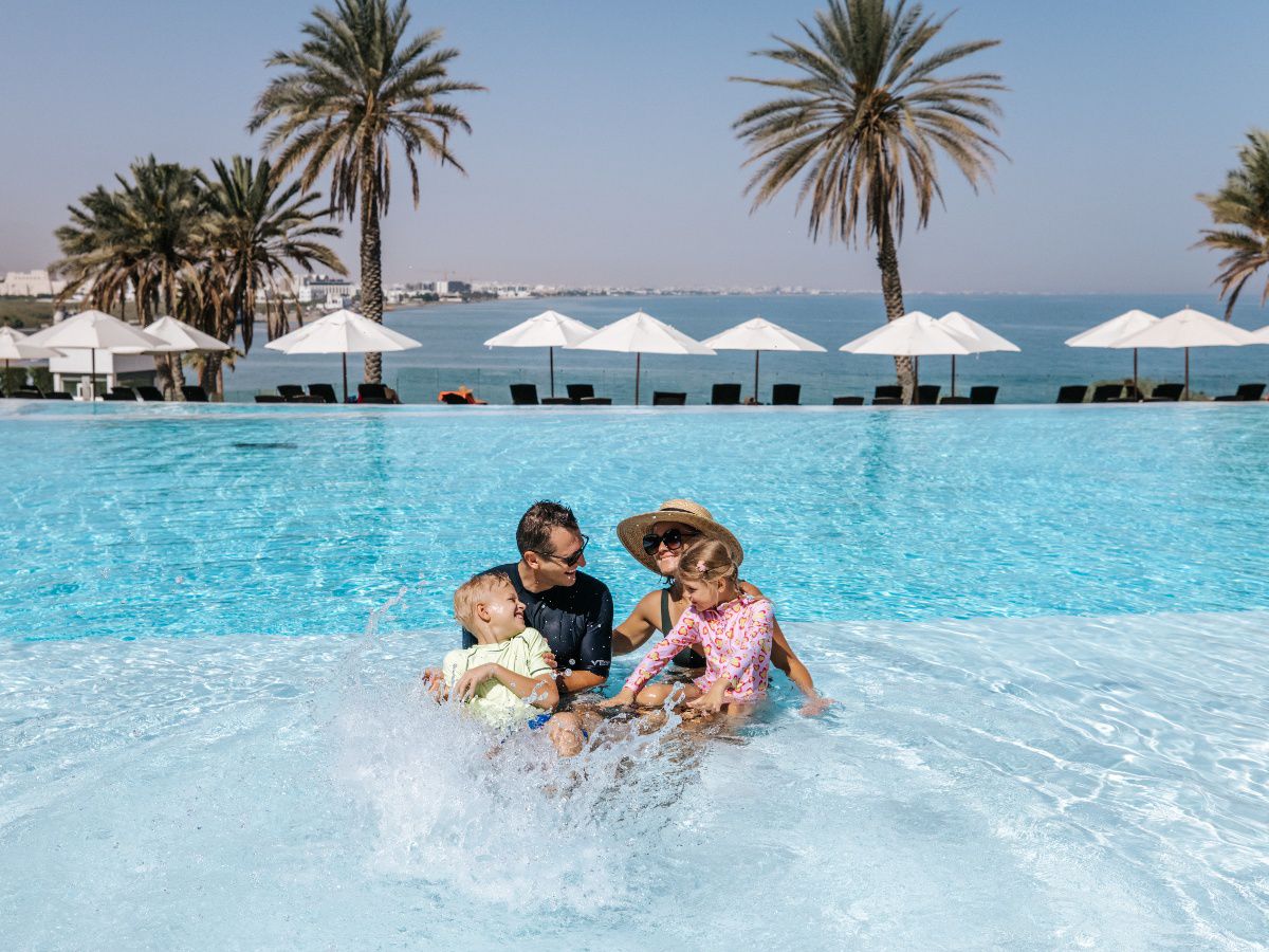 Family enjoying a poolside getaway.