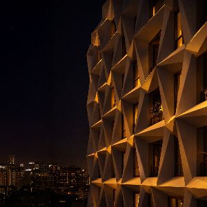 Contemporary design illuminated against the city skyline.