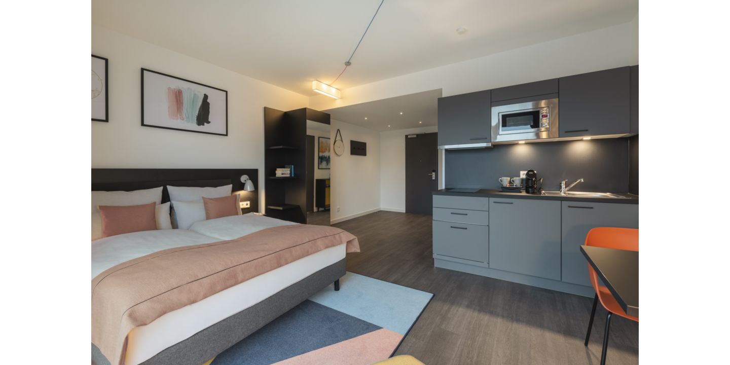 A guest suite featuring a living room and kitchen