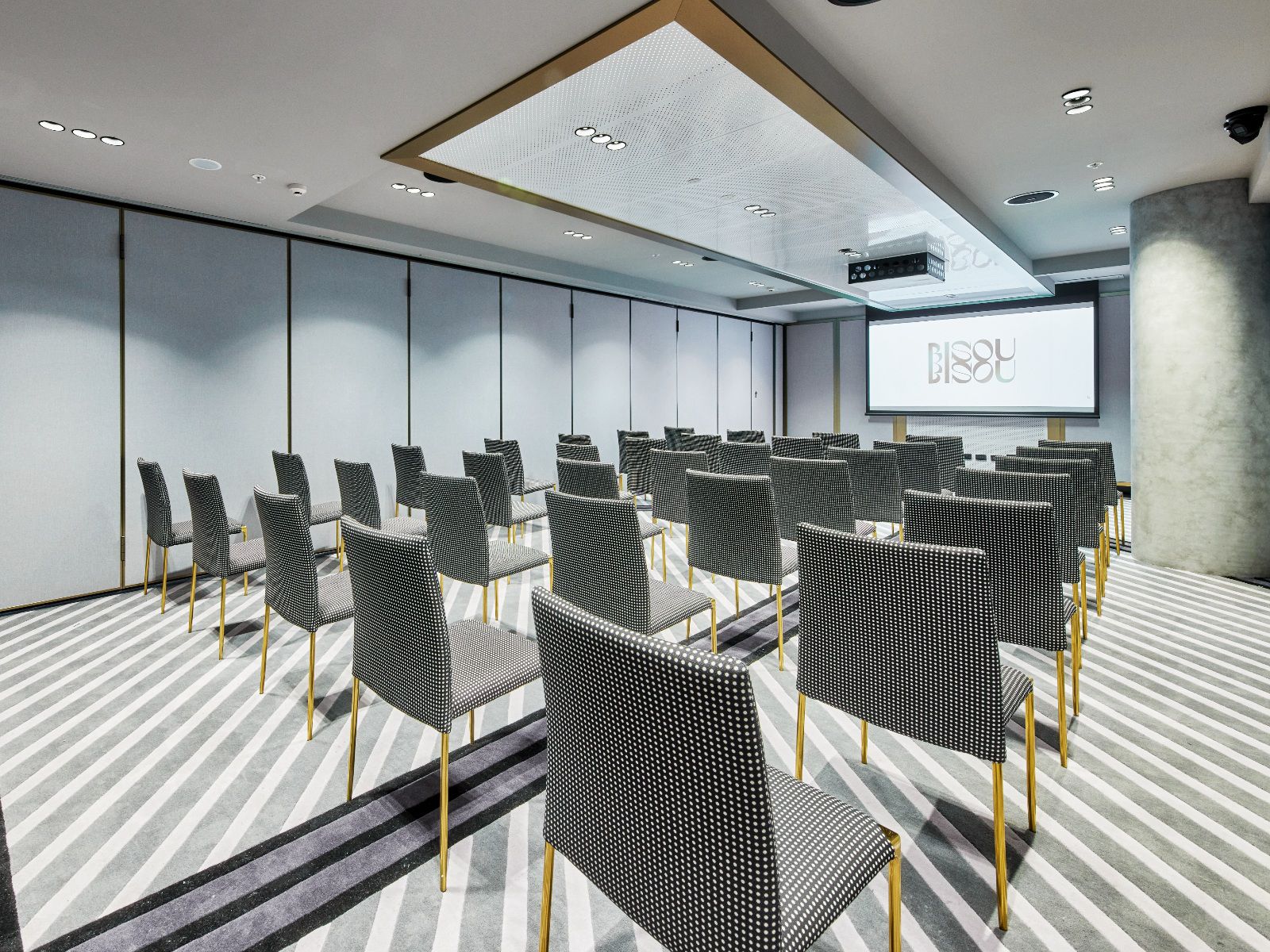 A contemporary event space tailored for presentations, meetings, and conferences.