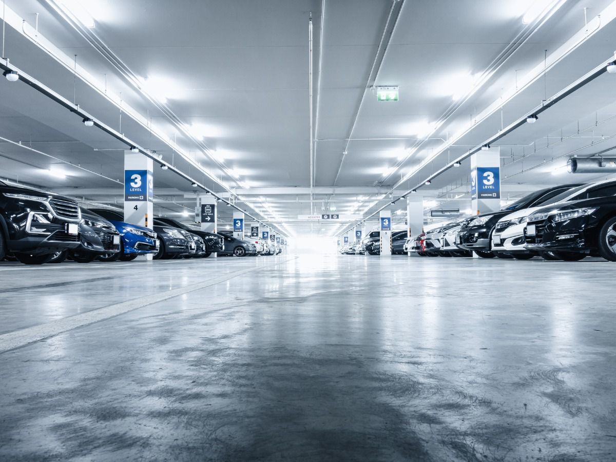 Spacious underground parking garage with parked vehicles