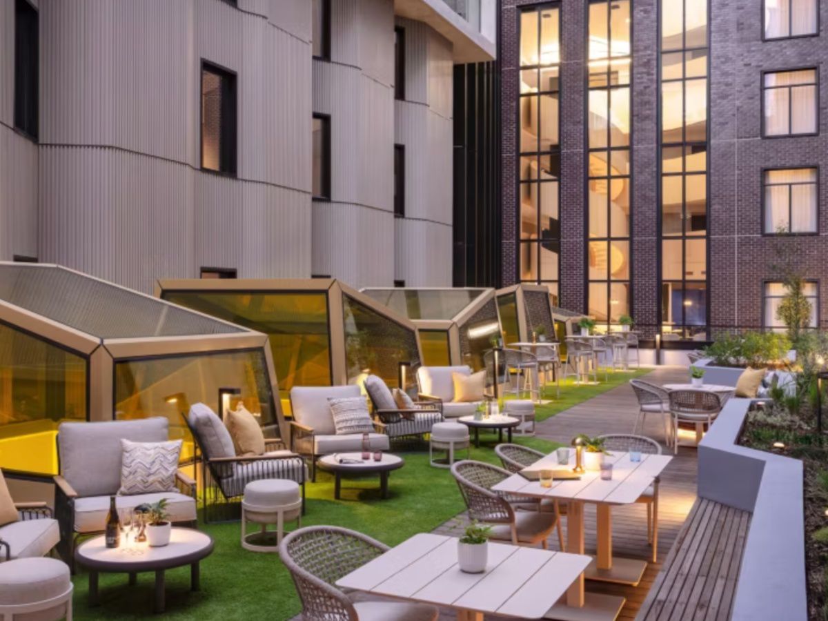 Modern outdoor courtyard with stylish lounge and seating