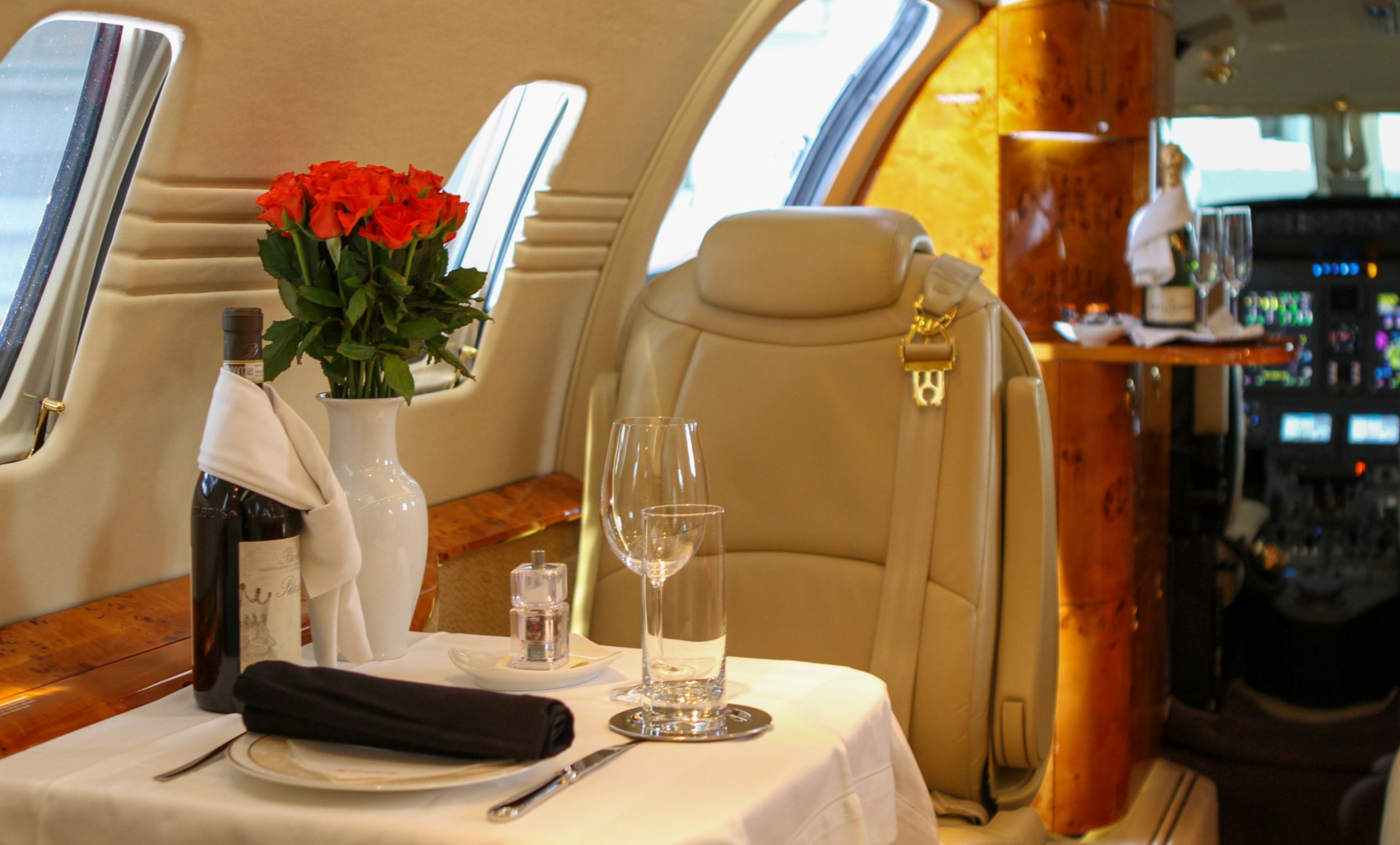 Interior of private jet with table setting
