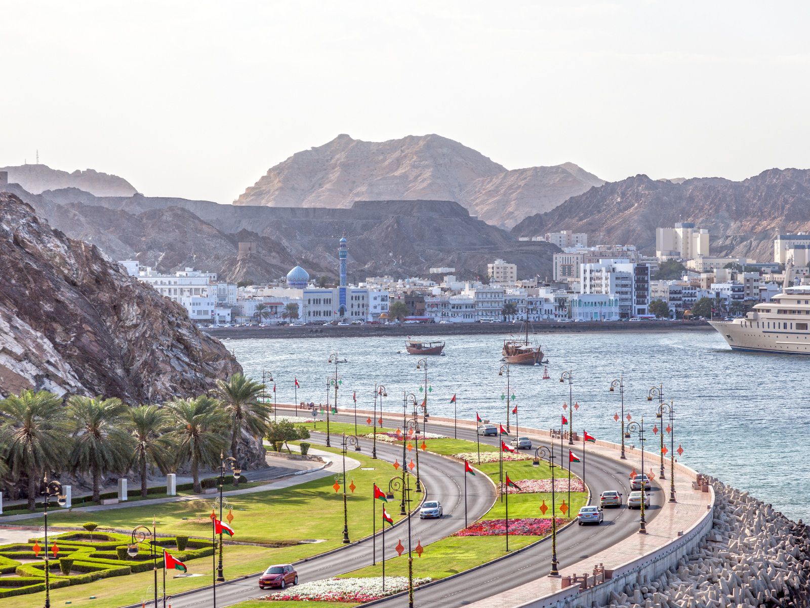 Scenic coastal city with mountain backdrop