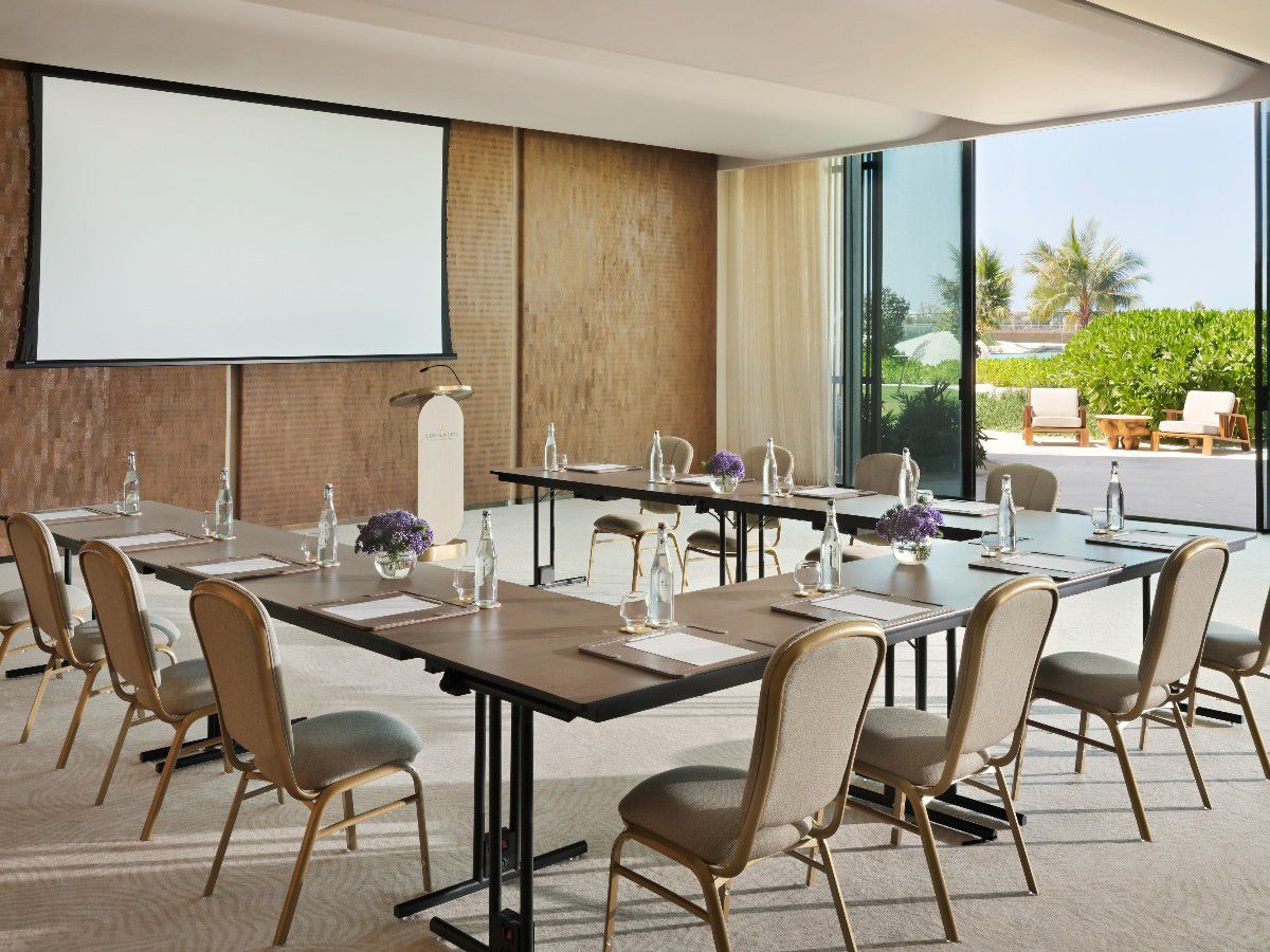 Elegant meeting room with tropical outdoor view.