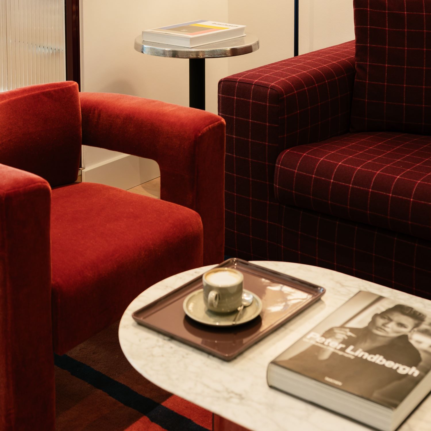 Kimpton Interior with red plush chairs 