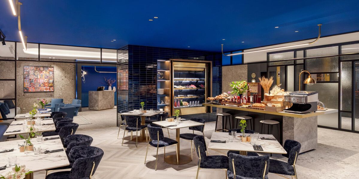 Elegant restaurant interior with buffet and seating.