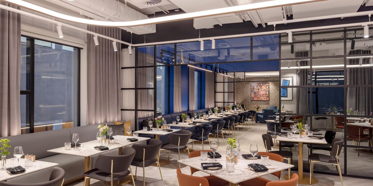 Modern restaurant interior with elegant dining tables.