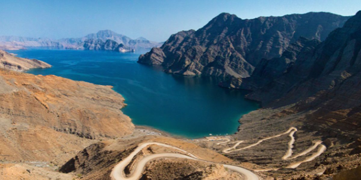 Desert bay and winding mountain road.