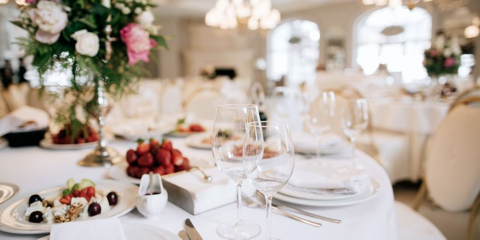 Elegant table setting with glassware and plated appetizers