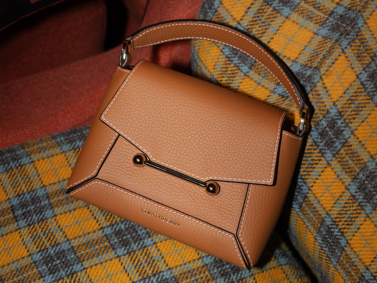 Strathberry handbag placed in a cinema seat