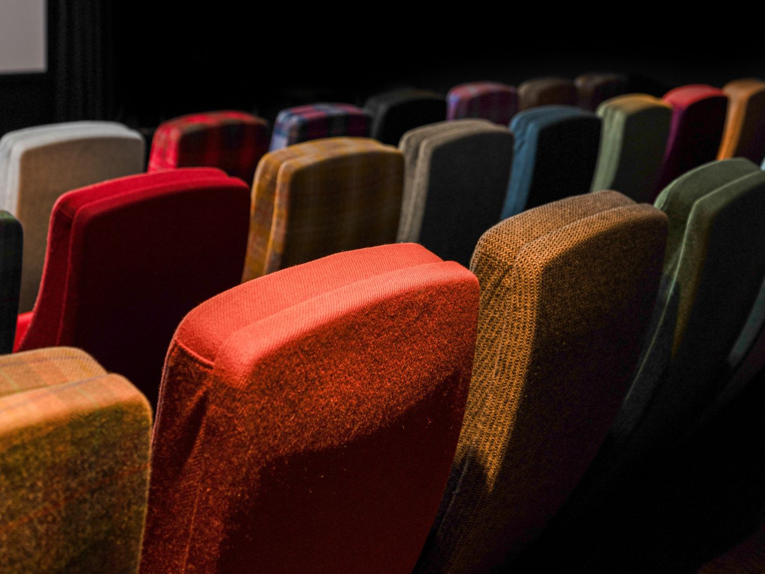 Colourful coloured cinema seats in a theatre