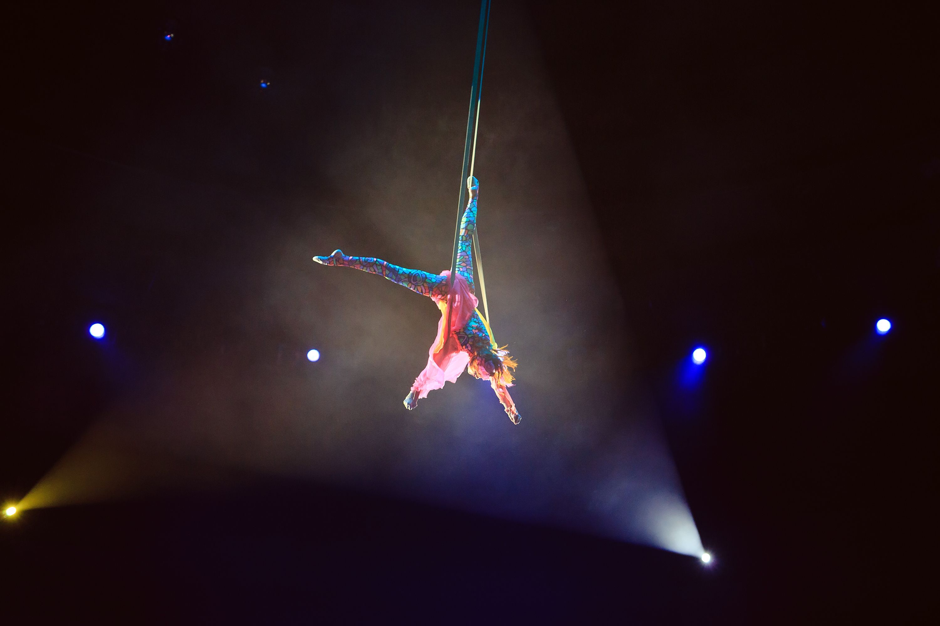 woman performing acrobatics in the air
