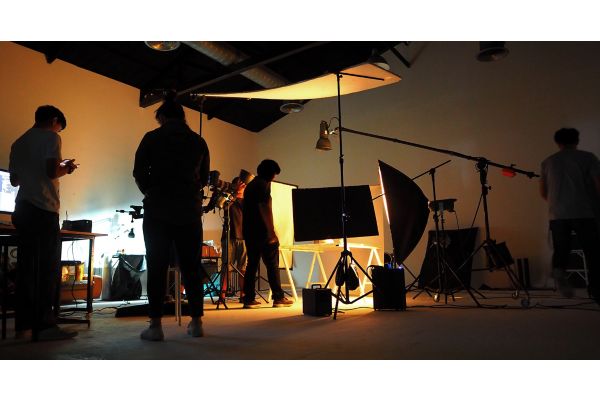 Production team shooting some video movie for tv commercial with studio equipment set.