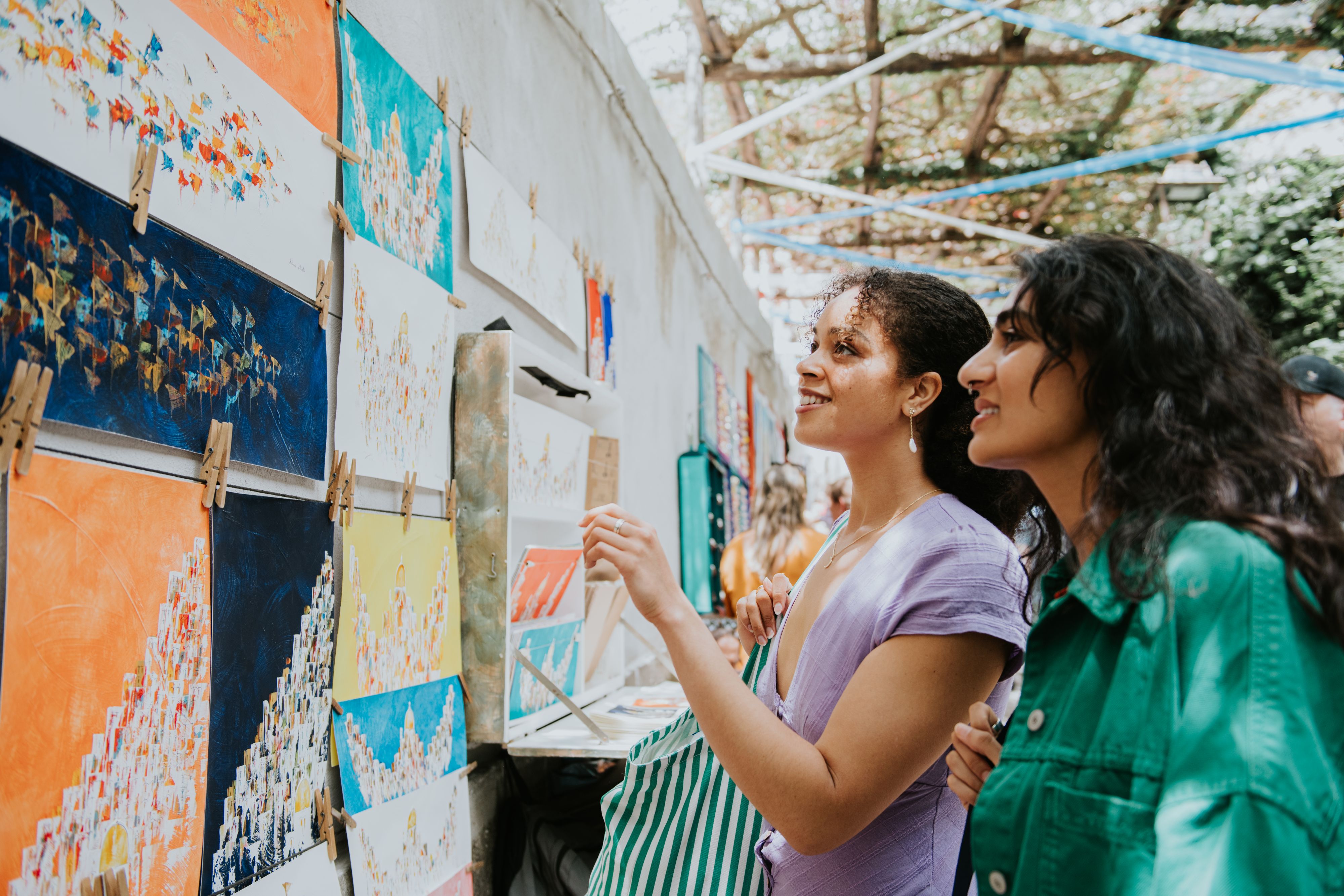 Women looking at paintings