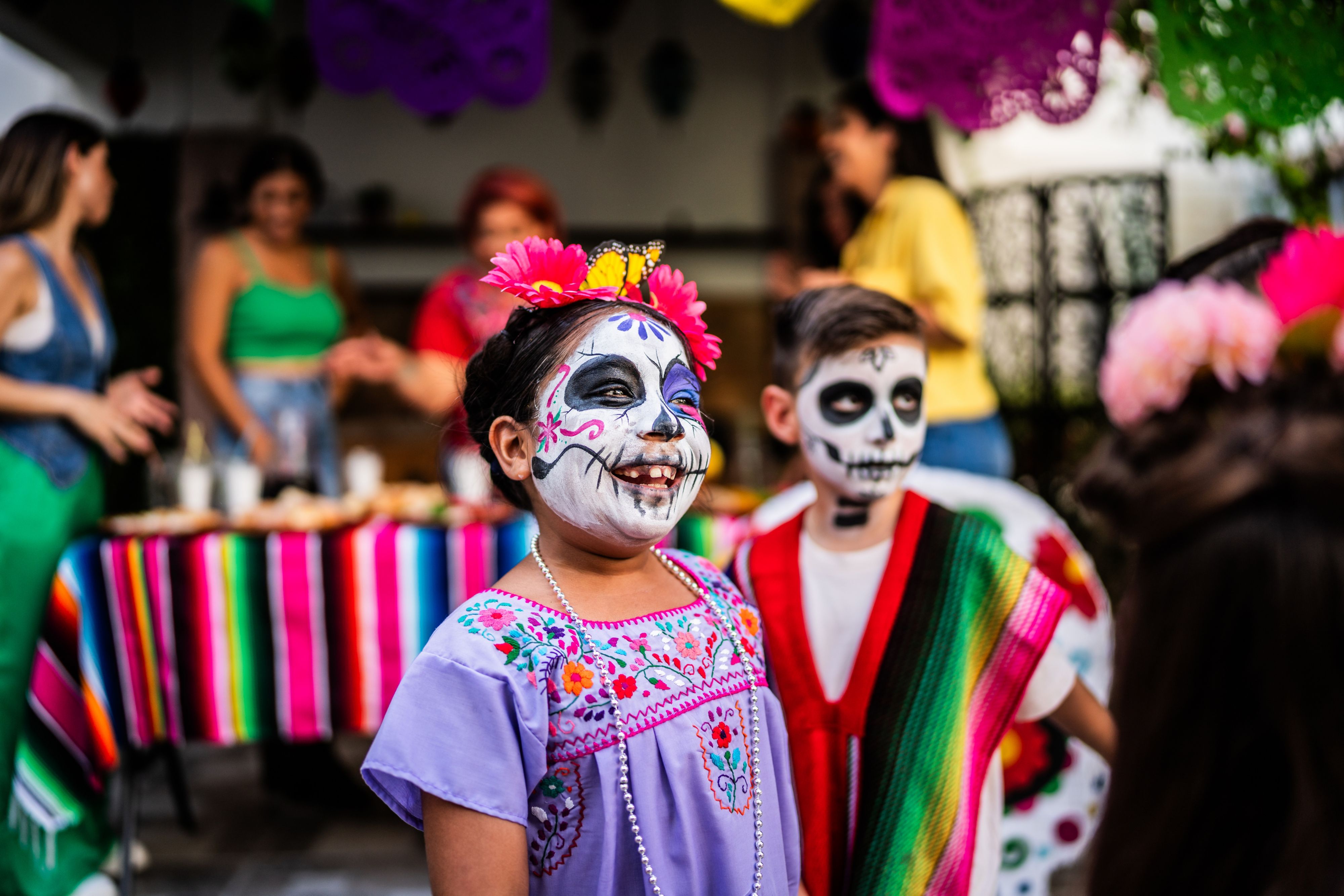 Kids in Dia De Los Muertos face paint