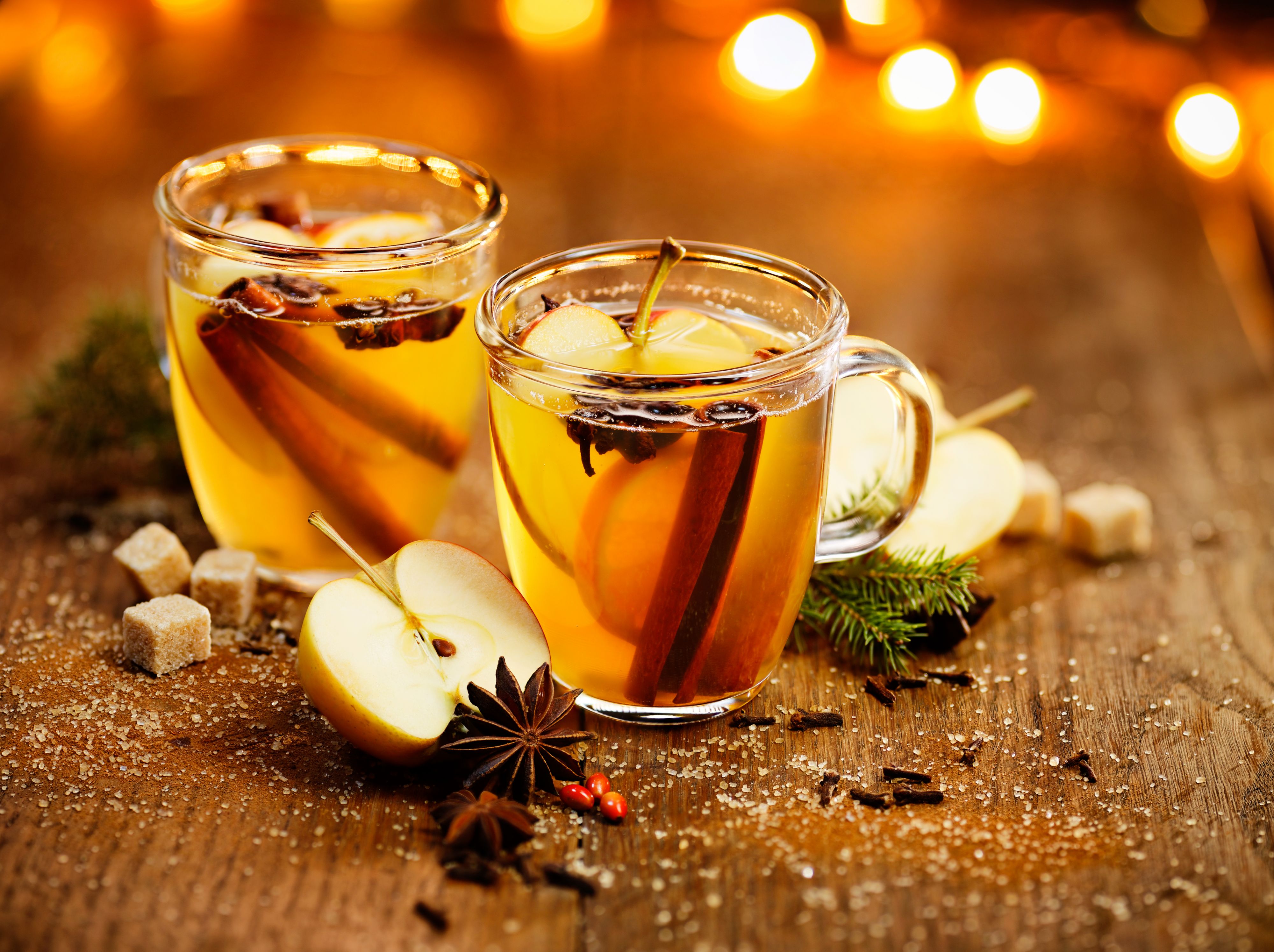 Hot cider with addition of cinnamon sticks, anise stars, cloves and citrus fruits