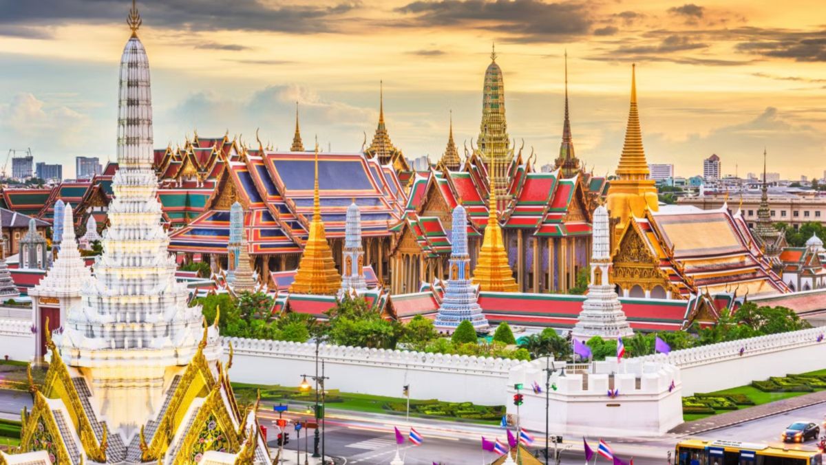Historic palace complex featuring ornate temples and traditional Thai architecture.