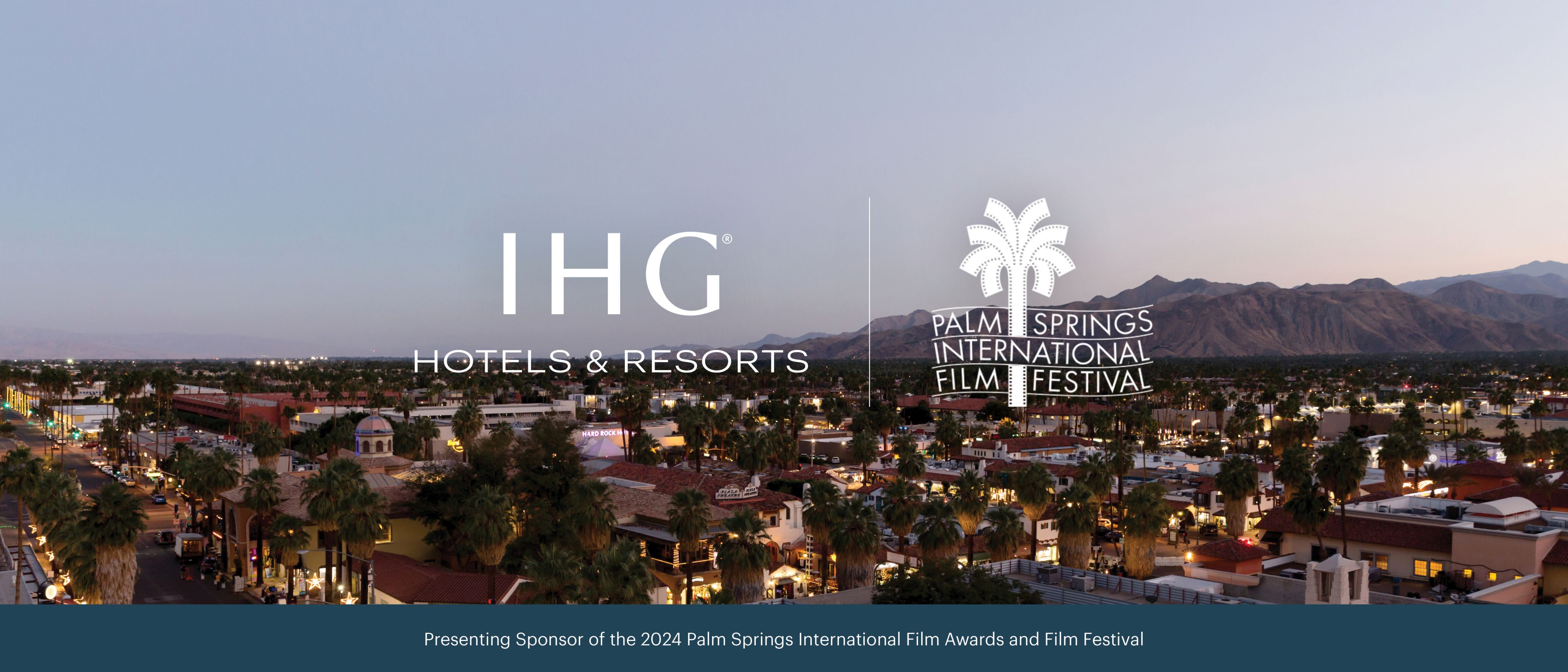 aerial view of palm springs at dusk with mountain background