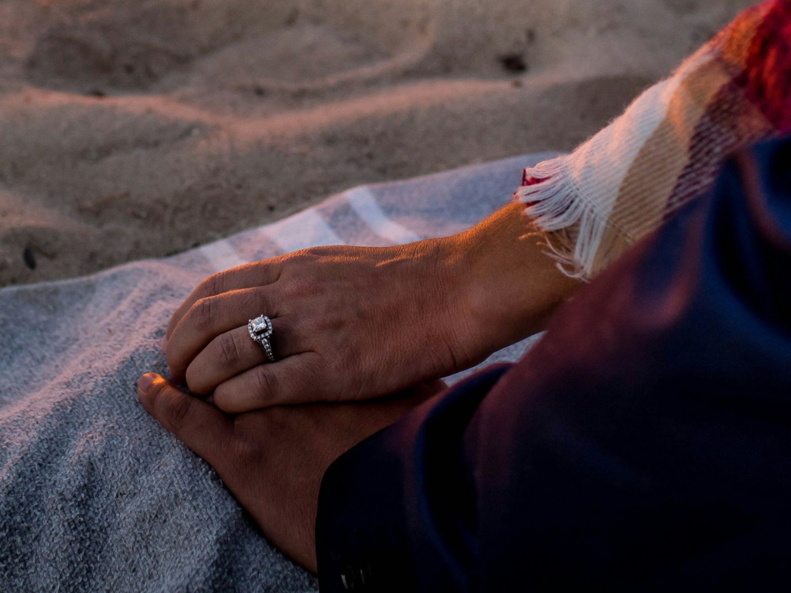 Romantic beach moment with engagement ring