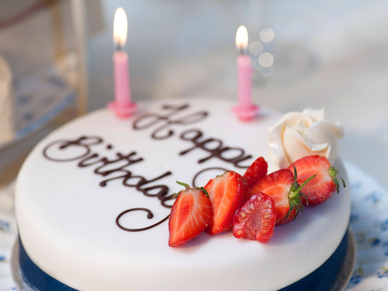 Birthday celebration cake with fresh strawberries