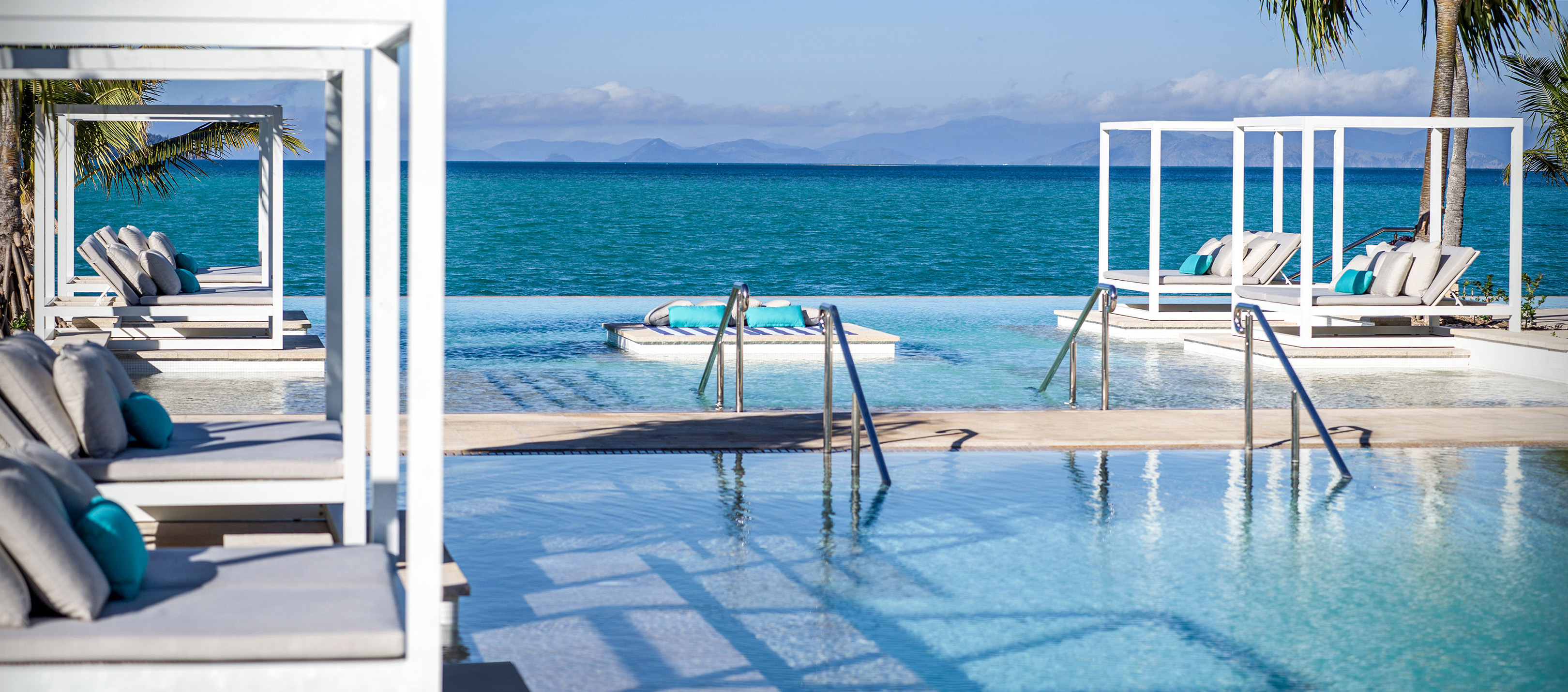 Table and chairs on balcony overlooking Syndney