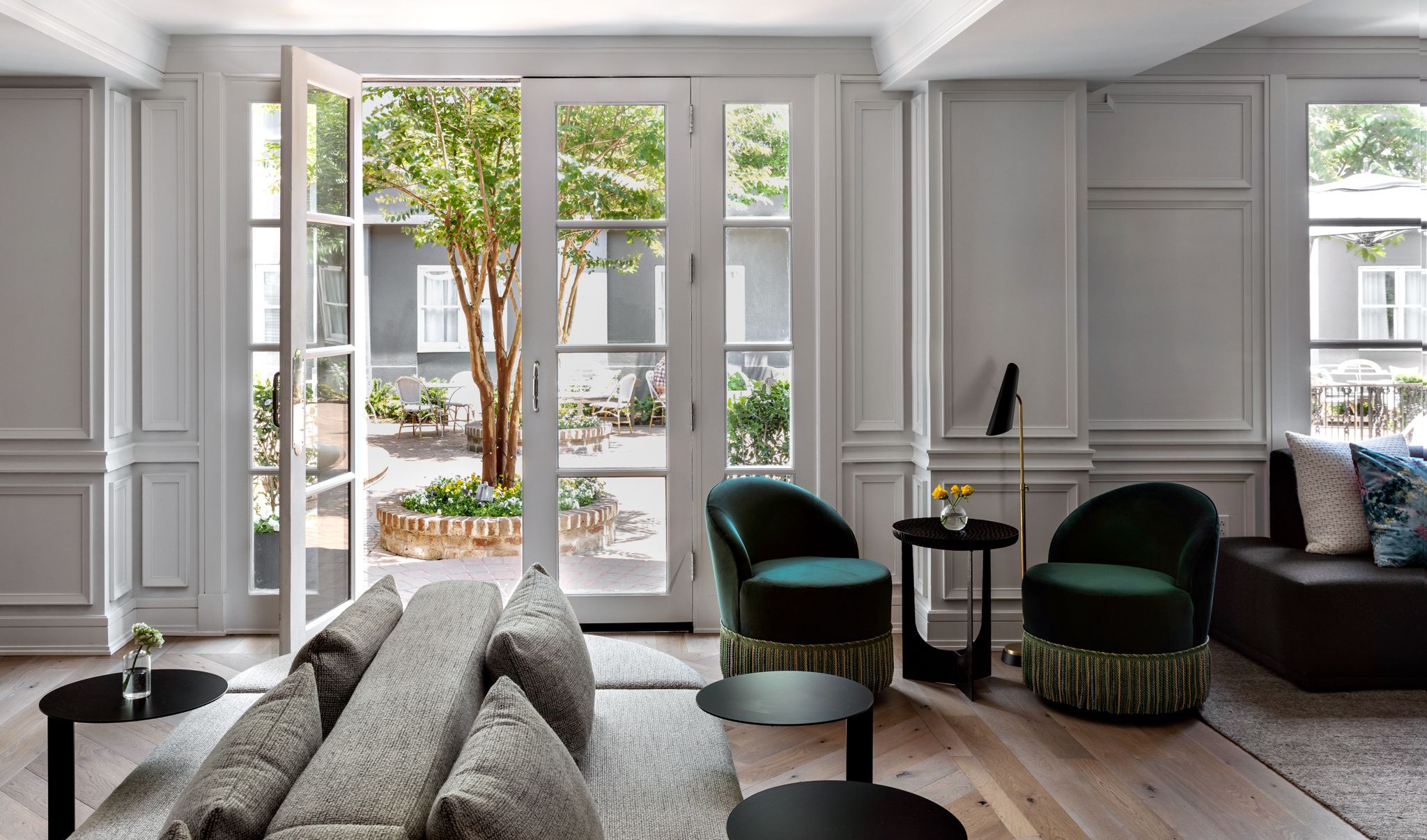 lobby living room with views of lush courtyard