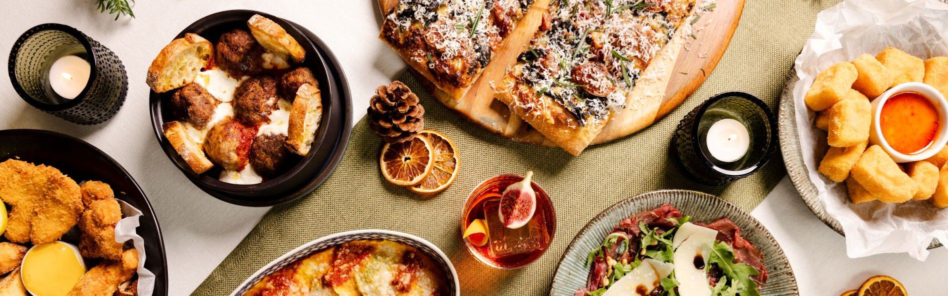 Winter feast featuring various dishes like pizza, salad and more