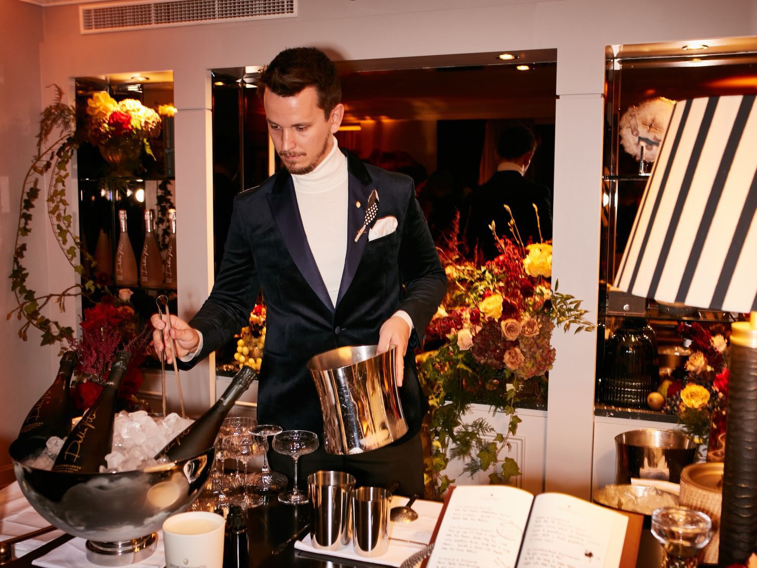 Bar man preparing bottle of champagne at an event