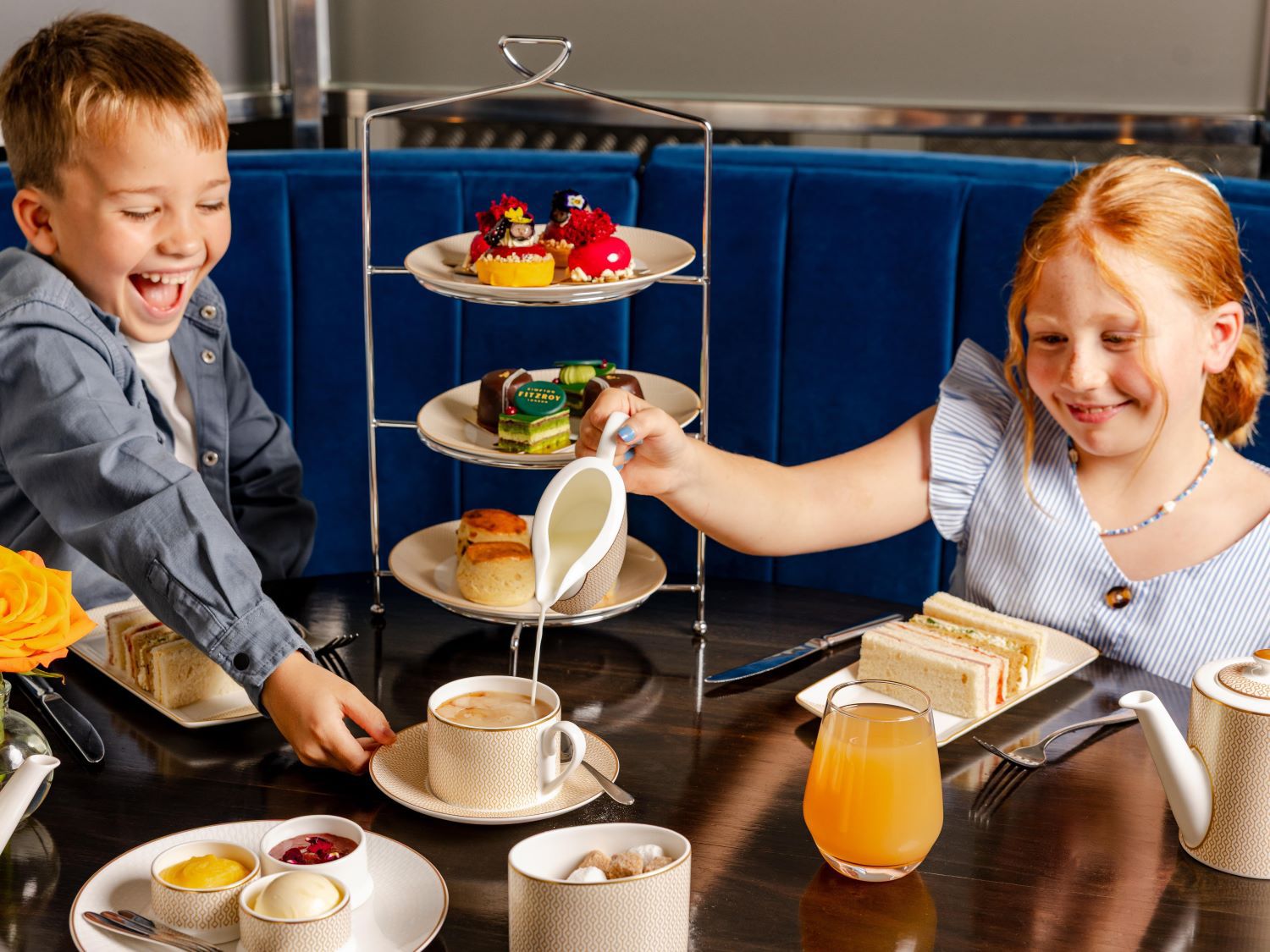 Two children having afternoon tea