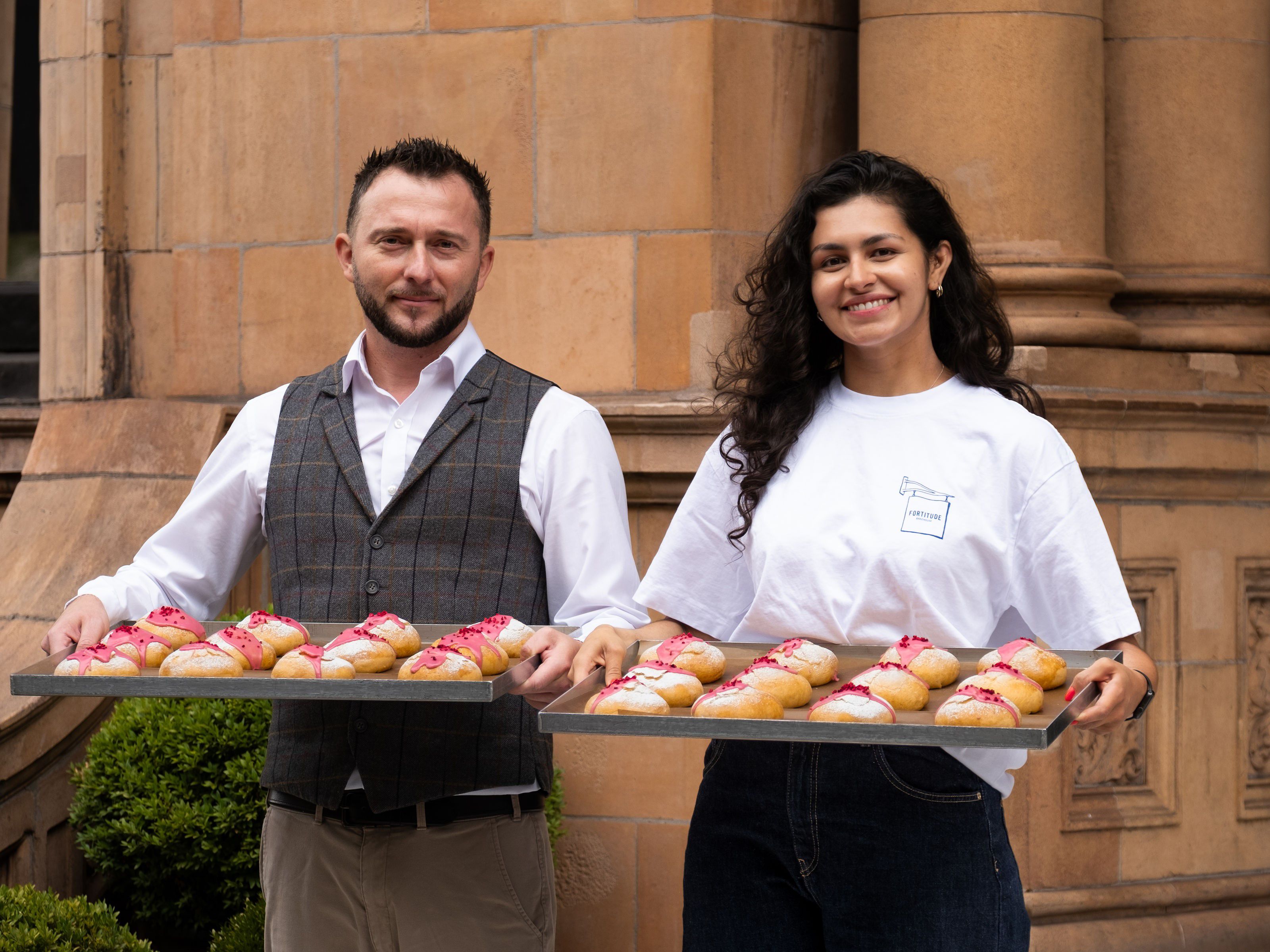 two bakers holding Kimpton buns