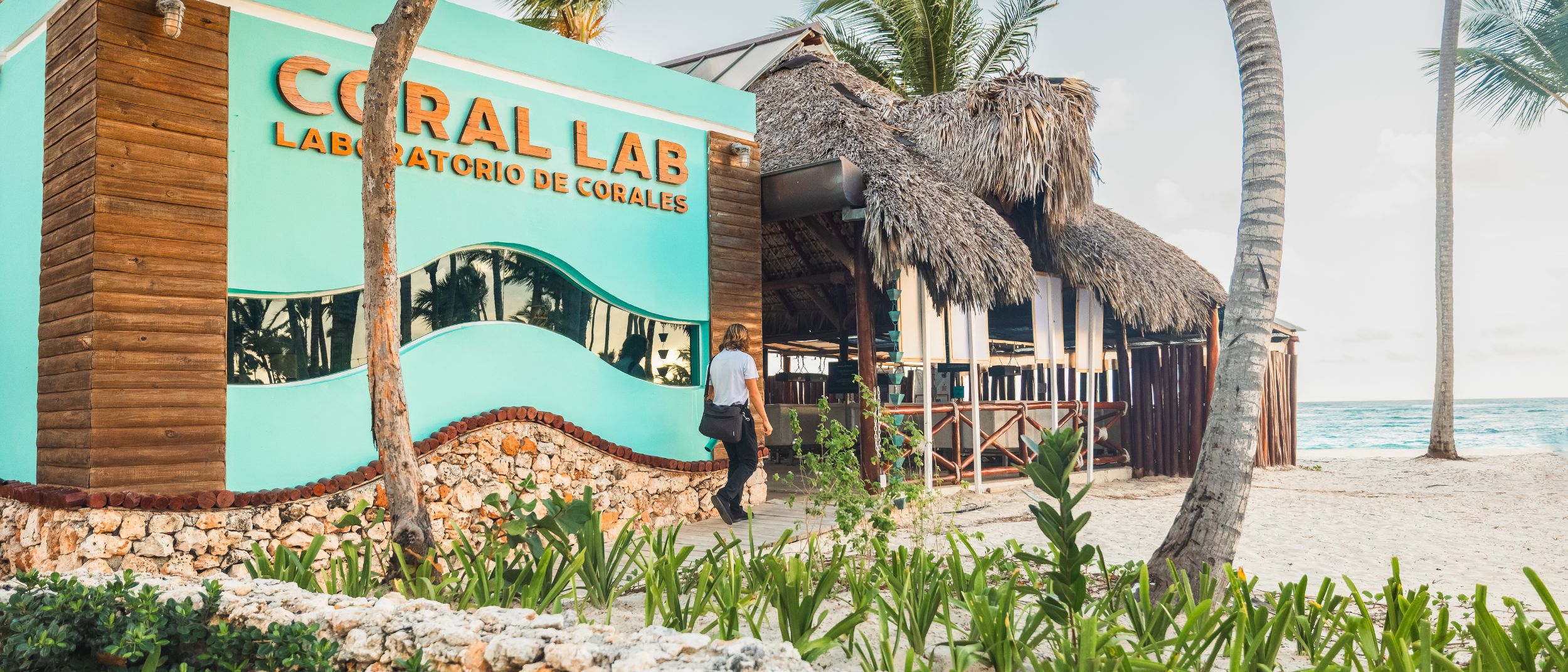 Beachfront Coral Lab building with thatched roof hut