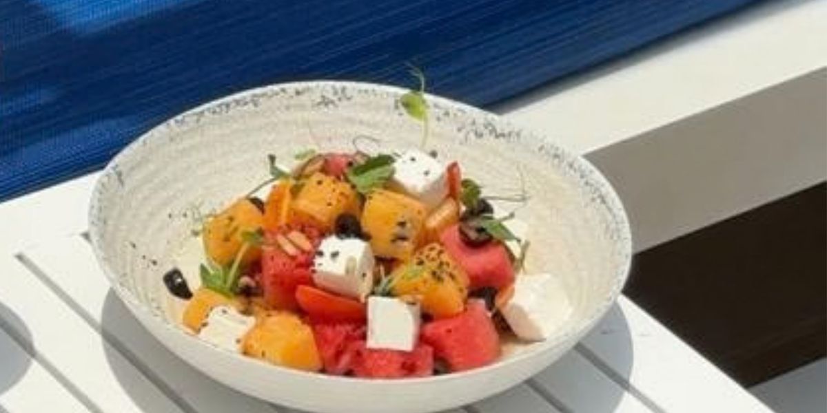 Refreshing watermelon, melon, feta salad with herbs.