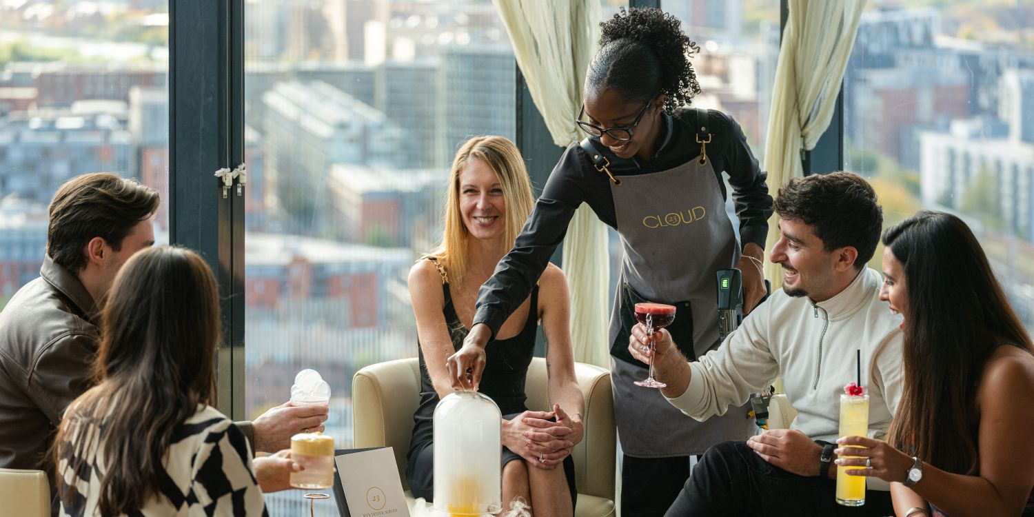 group being served cocktails