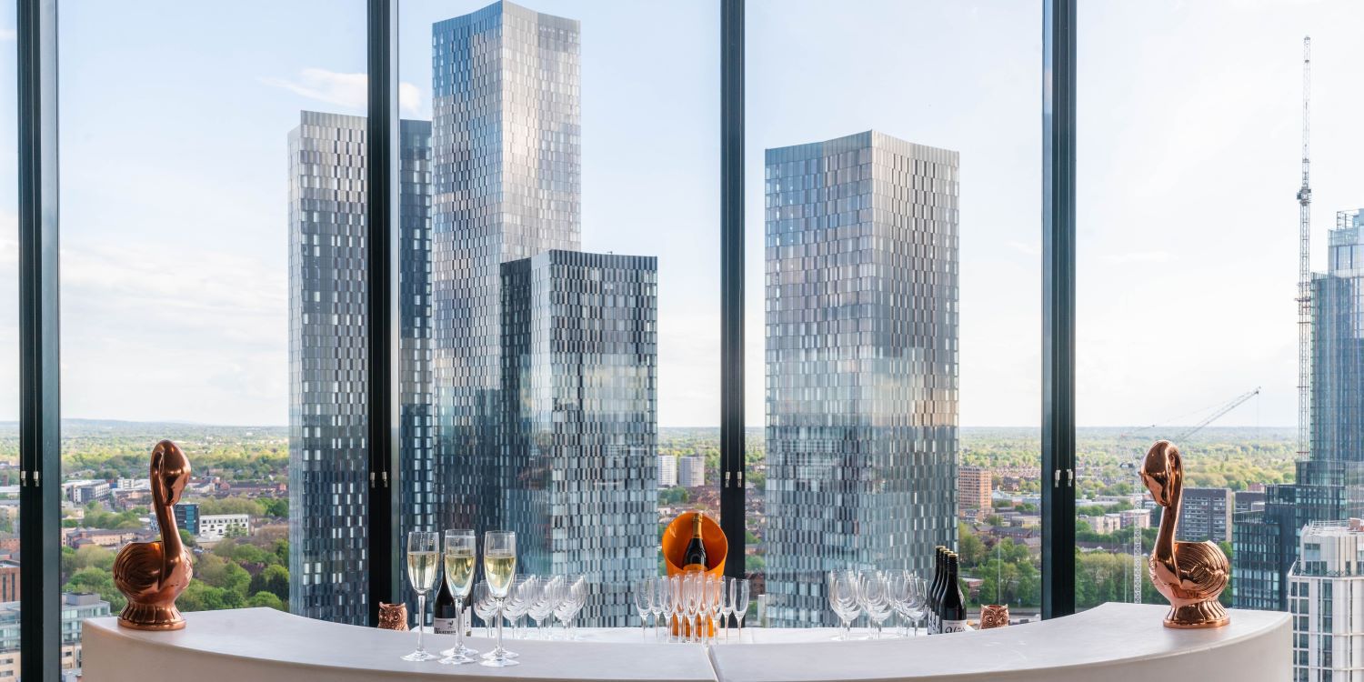 Cocktails in the cloud bar with panoramic view of Manchester