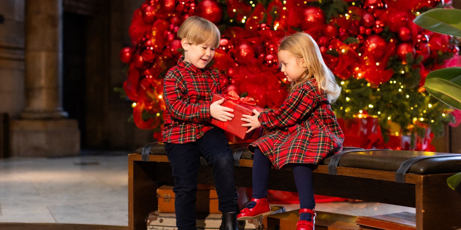 Children sharing christmas presesnts