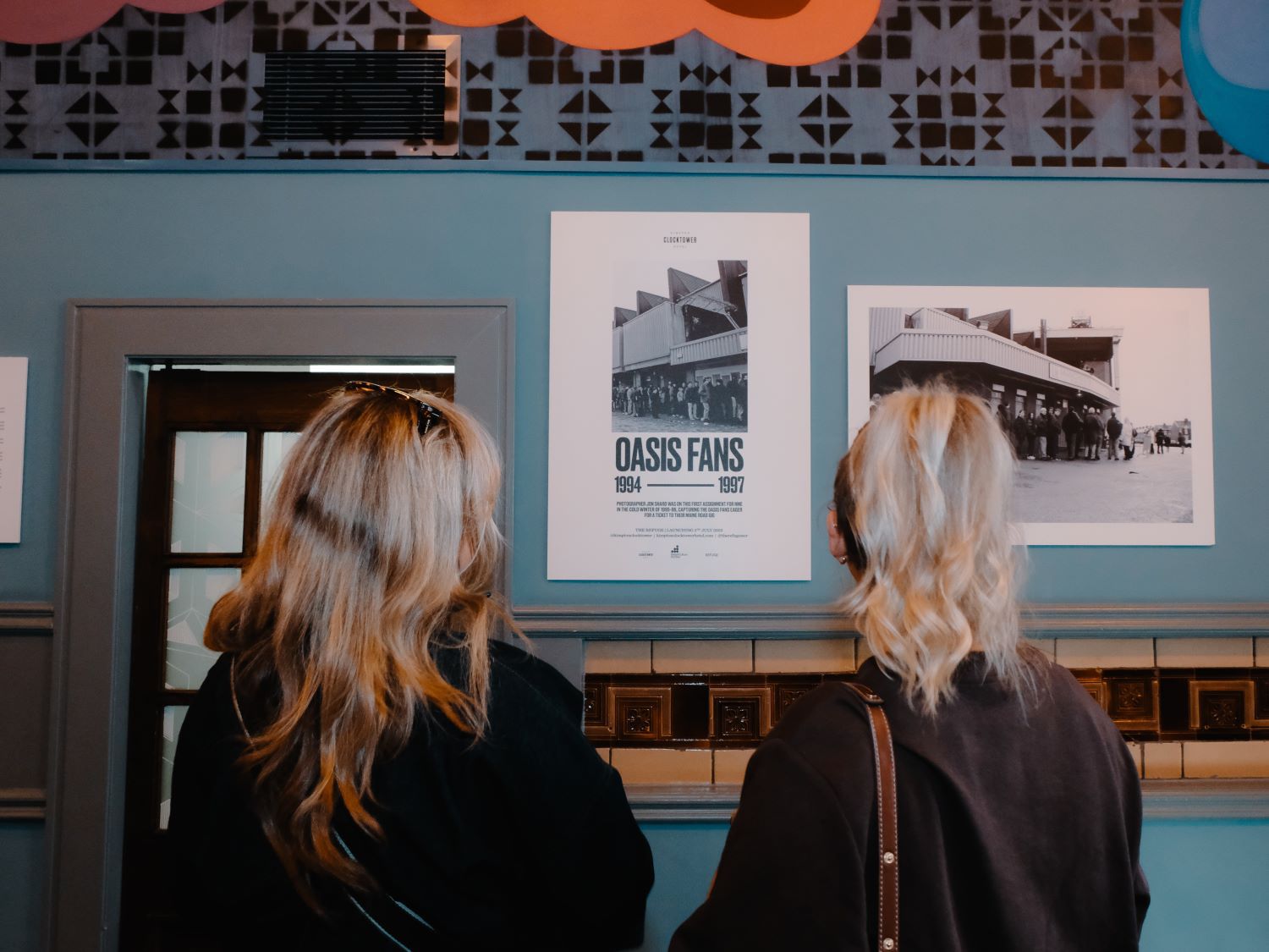 Twi girls viewing Oasis exhibition