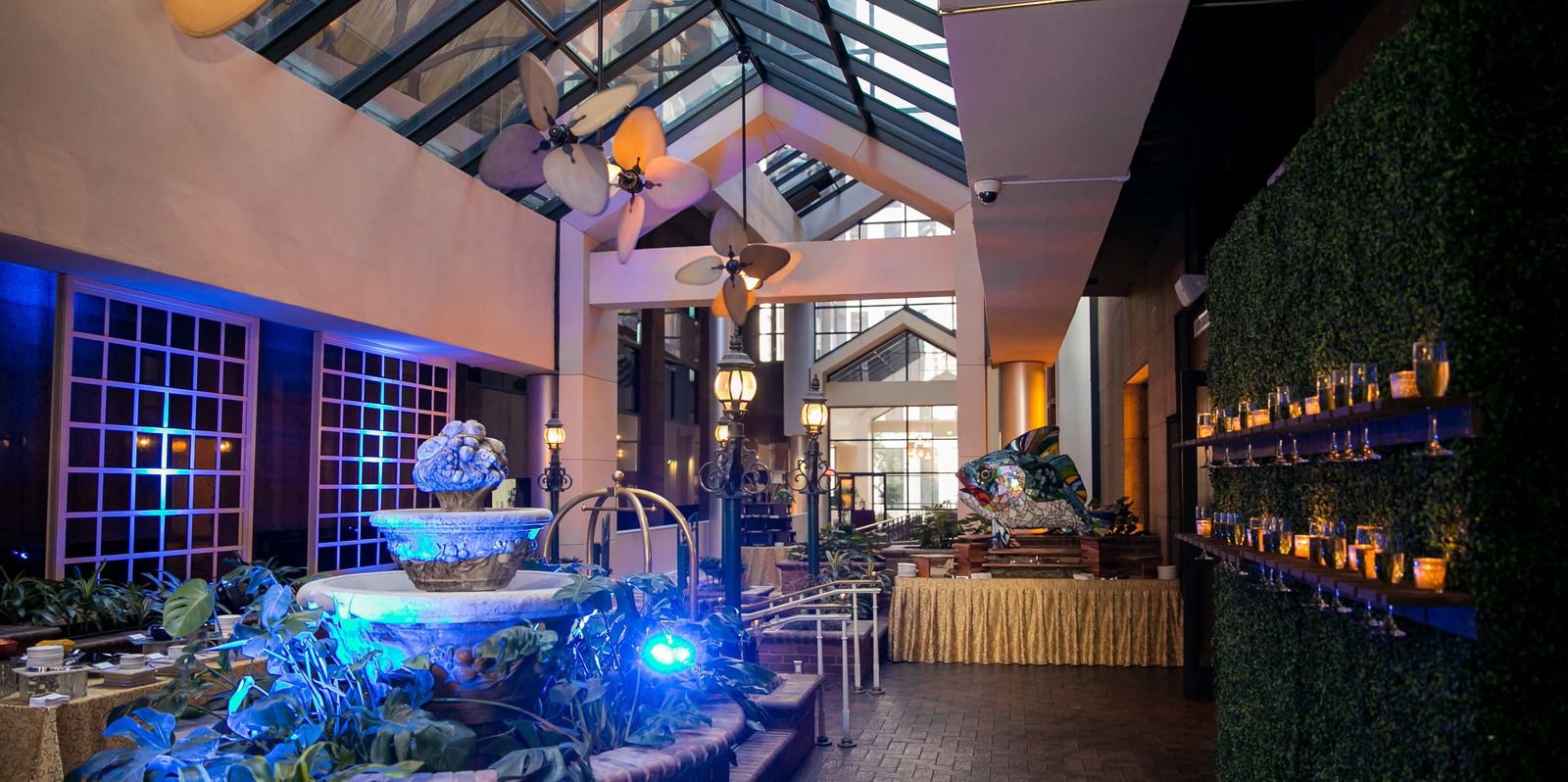 Atrium with a cake table and dj booth