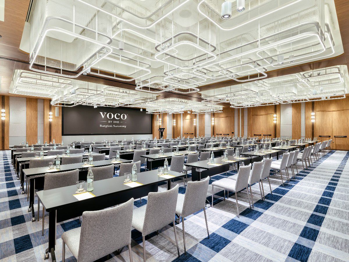 Spacious ballroom with modern lighting and conference-style seating.