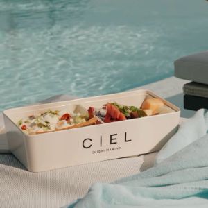 Meal box by the pool with food inside