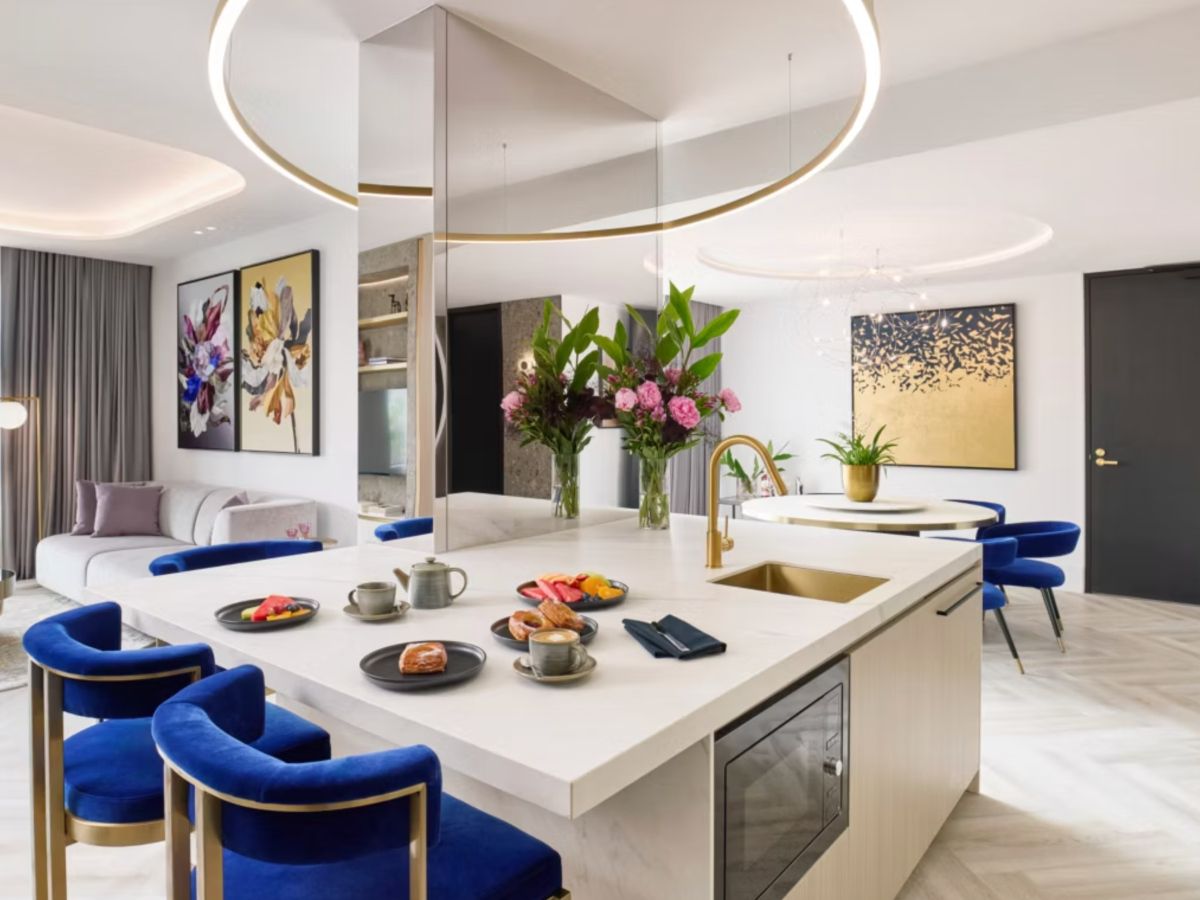 Luxurious presidential suite with modern kitchen and dining