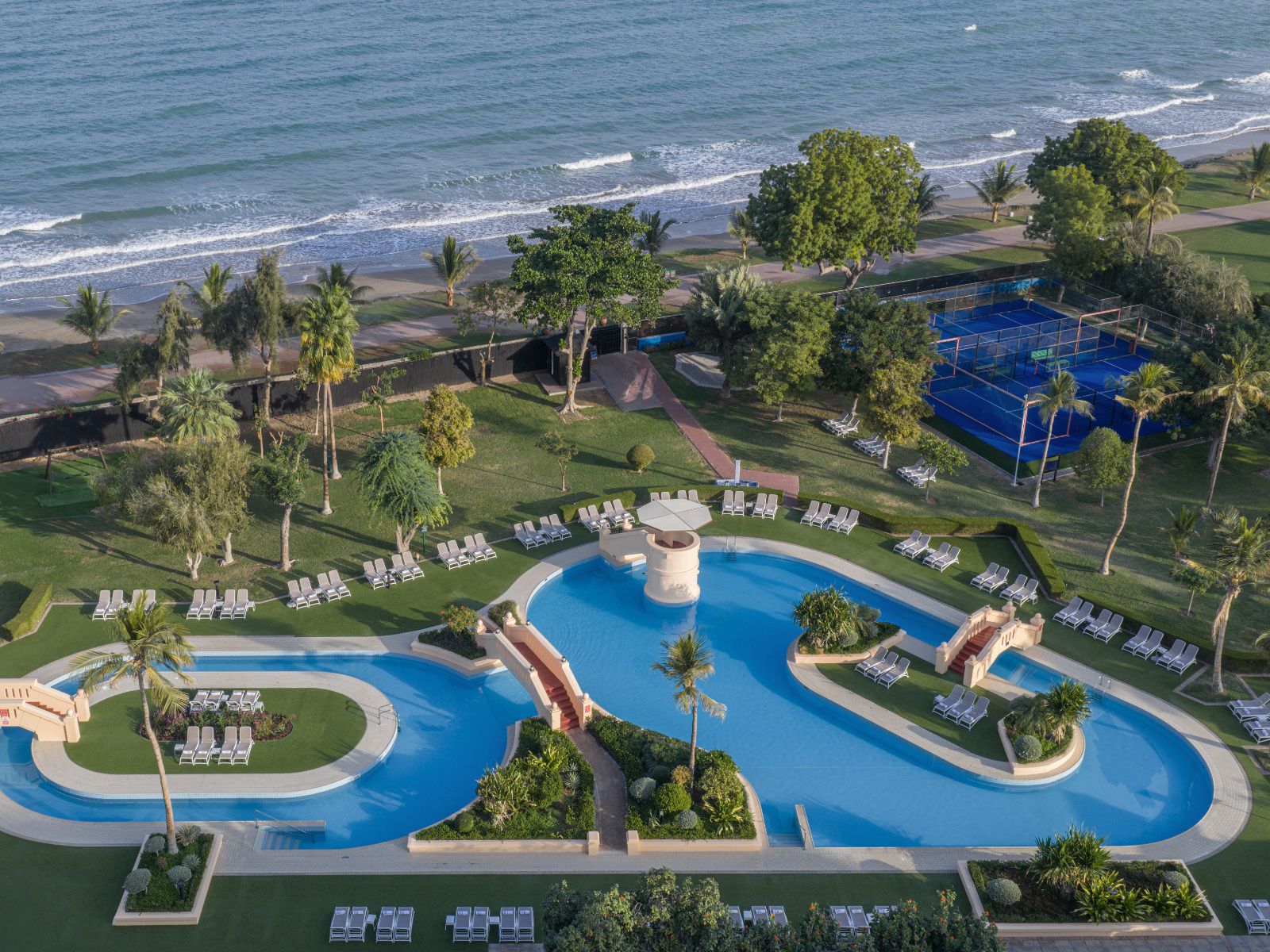Beachfront pool oasis with tennis courts