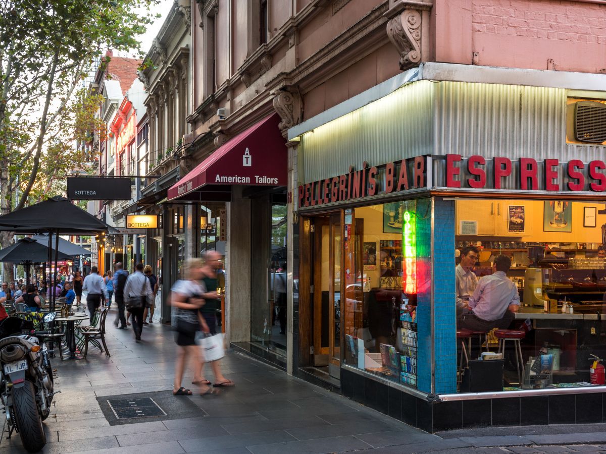 Bustling city streetscape with iconic corner café exterior