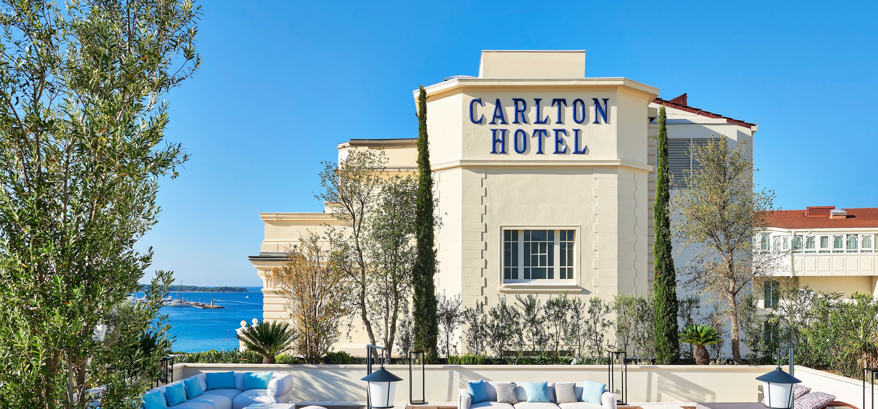 exterior of the regent hotel in cannes with rooftop deck in foreground