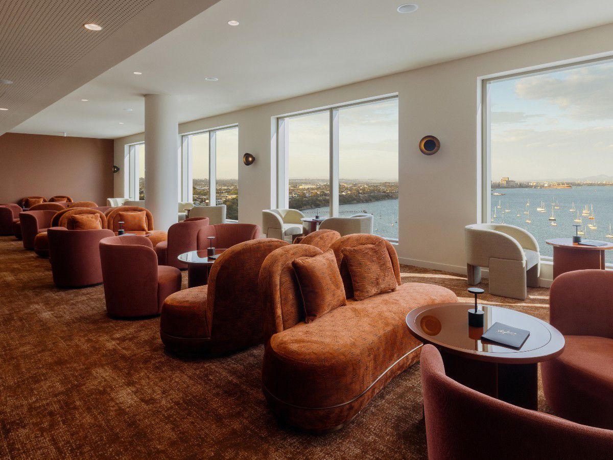 Elegant waterfront lounge with plush seating and ocean views.